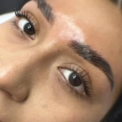 a closeup of a woman's face showing her eyebrows done well as part of a beauty treatment by waxination.nl in Amsterdam